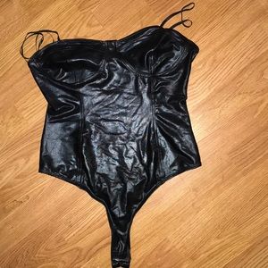 Never worn Sleek black corset style body suit